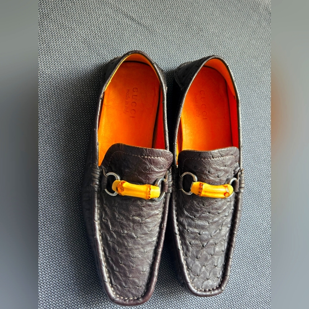 GUCCI loafers come in rich chocolate brown Ostrich textured leather w/ Bamboo